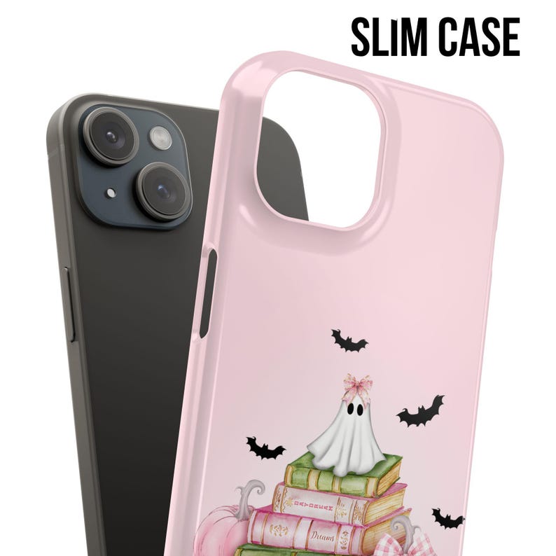 May include: A pink phone case with a ghost sitting on a stack of books. Bats are flying around the ghost. The text "SLIM CASE" is in the upper right corner of the image.