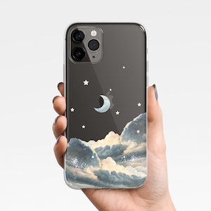 Może przedstawiać: Przezroczyste etui na telefon z czarnym tłem i wzorem białych chmur, gwiazd i półksiężyca.