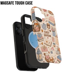 May include: A MagSafe tough phone case featuring a cream background with a pattern of autumn-themed illustrations including pumpkins, books, candles, lanterns, and a ghost, with the text COZY SEASON printed in brown letters on the back surface.