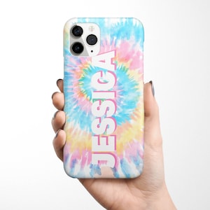 May include: A white iPhone case with a tie-dye pattern in shades of blue, pink, and yellow. The name "Jessica" is printed vertically in white with a pink outline.
