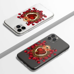 May include: Two clear phone cases with a design of a red heart with thorns and red roses. The heart has a cross on top and an arrow through it.