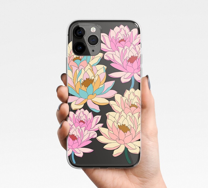 May include: A clear phone case with a floral design. The flowers are pink, yellow, and blue and have a watercolor look. The case is compatible with an iPhone.