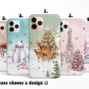 May include: Five different phone case designs featuring winter holiday themes. The designs include a polar bear, a Christmas tree, the Eiffel Tower, ice skates, and a winter scene with a sleigh.
