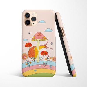 May include: A pink and white phone case with a cartoon snail carrying a mushroom on its back. The snail is surrounded by colorful flowers and a rainbow.