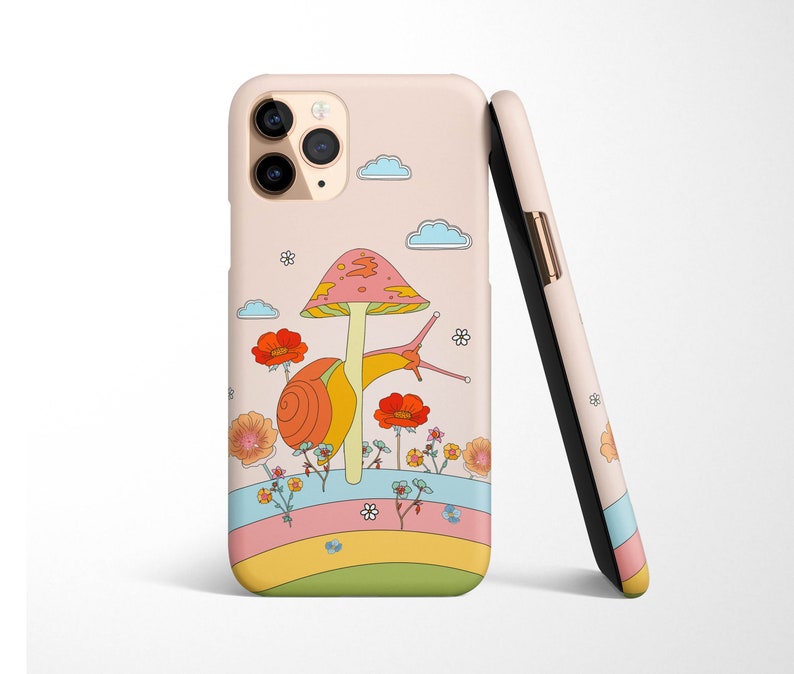 May include: A pink and white phone case with a cartoon snail carrying a mushroom on its back. The snail is surrounded by colorful flowers and a rainbow.