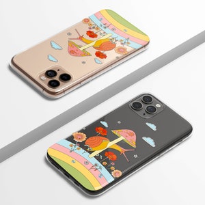 May include: Two clear phone cases with colorful designs. One case features a snail with a mushroom cap, flowers, and a rainbow. The other case has a similar design with a snail, flowers, and a rainbow. The cases are designed to fit a smartphone.