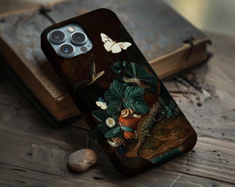 May include: Dark brown phone case featuring a detailed painting of a snake, butterflies, a lizard, and a snail amidst lush foliage. The artwork has a vintage aesthetic, with a focus on natural elements and a rich color palette.
