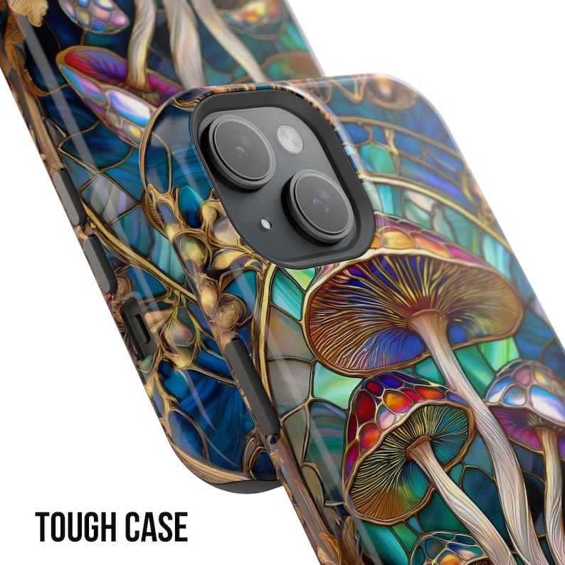May include: A close-up of a phone case with a colorful mushroom design. The case features a stained-glass style with blue, gold, red, and brown hues. The text "TOUGH CASE" is printed in white at the bottom.