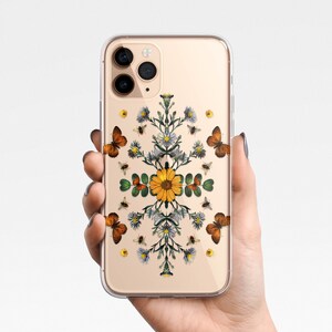 May include: A clear phone case with a floral design featuring butterflies, bees, and sunflowers. The case is designed for an iPhone.
