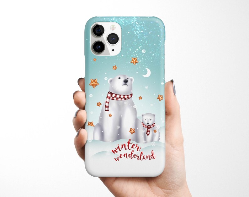 May include: A blue and white phone case with a winter wonderland theme. It features two polar bears, one large and one small, wearing red and white scarves. The case also has a snowflake design and the text "winter wonderland".