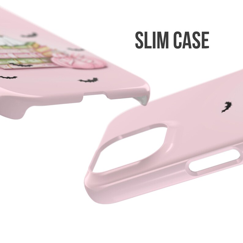 May include: A pink phone case with a cute cartoon design featuring bats and a spooky character. The case is labeled "SLIM CASE".