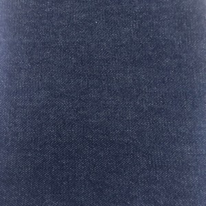 May include: Close-up of a swatch of dark blue denim fabric. The fabric has a textured surface with a diagonal weave pattern. The color is a deep indigo, with subtle variations in tone.