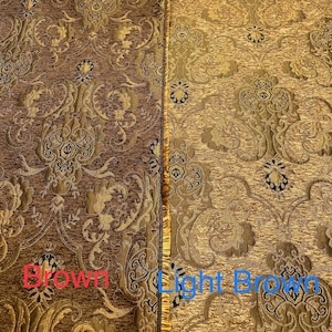 May include: Close-up of two fabric swatches, one brown and one light brown. Both fabrics feature a gold and black damask pattern.