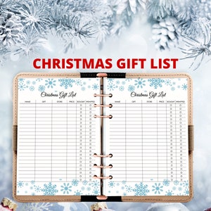 May include: A white planner with a blue snowflake design and the text "Christmas Gift List" on the cover. The planner has a black spine and is open to two pages with columns for name, gift, store, price, bought, and wrapped.