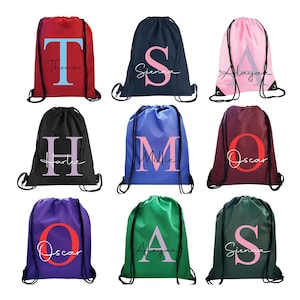 May include: Nine drawstring bags in various colours with a large letter and a name printed on the front. The letters are in different colours and the names are in black.