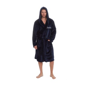 May include: A navy blue hooded robe with a white embroidered name "Josh" on the left side. The robe has a tie belt and two pockets.