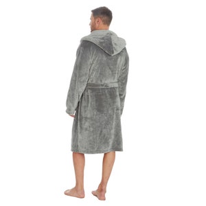 May include: A gray hooded robe with a self-tie belt. The robe is made of a soft, plush fabric.
