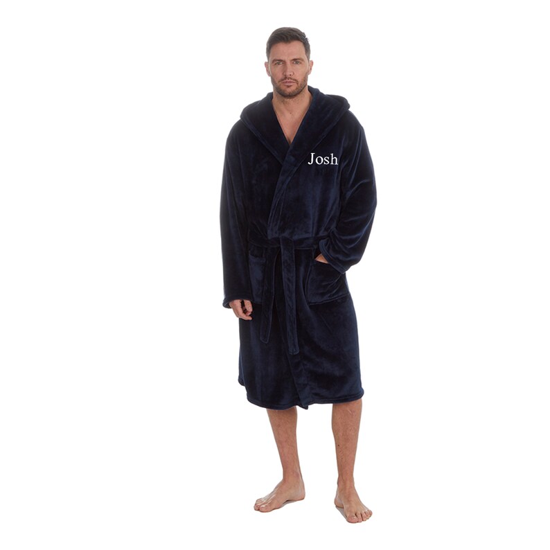 May include: A navy blue hooded robe with a white embroidered name "Josh" on the front.
