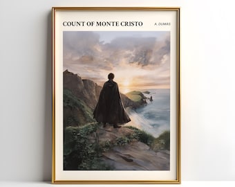 May include: Framed art print of "Count of Monte Cristo" by A. Dumas. The artwork depicts a figure in a dark cloak standing on a cliff overlooking the ocean at sunset. The print is in a gold frame.