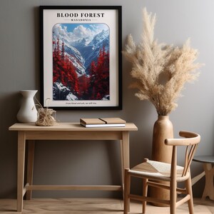 May include: A framed poster with a mountain landscape and red trees. The poster has the text "BLOOD FOREST - MASADONIA" and the quote "From blood and ash, we will rise."