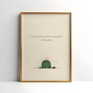 May include: Framed art print featuring a quote by Bilbo Baggins: "It is no bad thing to celebrate a simple life." The artwork depicts a green door set into a grassy hill. The frame is gold.