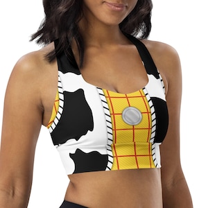May include: A black and white sports bra with a yellow and red pattern. The pattern is reminiscent of a popular cartoon character's outfit.