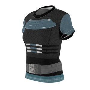 May include: A short-sleeve t-shirt in black with a blue chest plate graphic, three horizontal rows of white and blue rectangular accents on the midsection, and a gray utility belt graphic printed around the waist with a teal hem at the bottom.