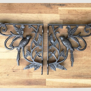 A pair of antique style Victorian exotic bird brackets cast iron shelf bracket