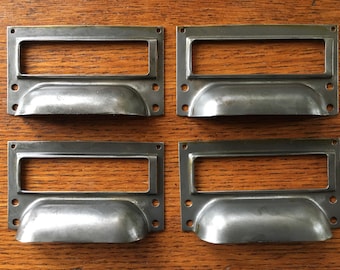 A set of four of vintage style steel filing cabinet handle with label holder