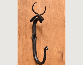 A handmade wrought iron cow hook co1