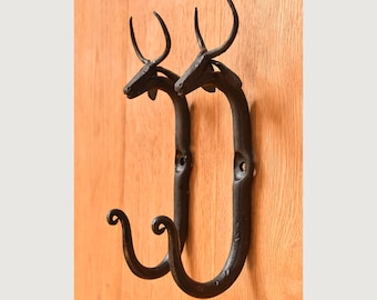 A Pair of hand made wrought Iron cow hooks co1