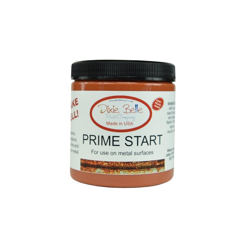 May include: A jar of Dixie Belle Paint Company's Prime Start primer for use on metal surfaces. The jar is orange and has a black lid. The label says "Prime Start" and "For use on metal surfaces".
