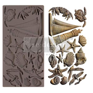 May include: A silicone mold with a variety of nautical themed designs, including a lighthouse, sailboat, seashells, starfish, and seagulls. The mold is made by ReDesign with the Imprinted logo.