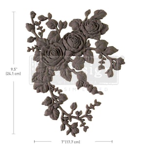 May include: A decorative metal floral design with a vine and roses. The design is 9.5 inches tall and 7 inches wide. The design is made of metal and has a brown finish.