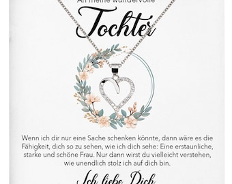 Puede incluir: Una tarjeta blanca con un collar plateado con un colgante en forma de corazón con cristales transparentes. La tarjeta tiene un diseño floral y el texto "An meine wundervolle Tochter" y "Ich liebe Dich".