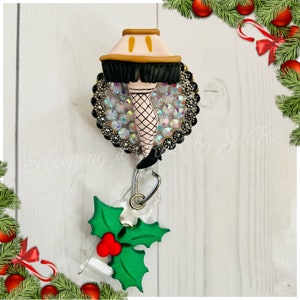 A Christmas story leg lamp themed badge reel