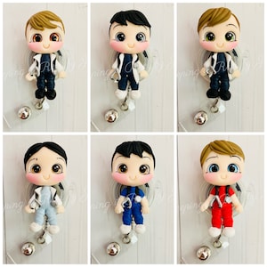 May include: Six different cartoon doctor figures with different coloured scrubs and hair colours. Each figure is attached to a retractable badge reel.