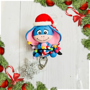 Eeyore Christmas donkey badge reel