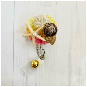 Sparkly seashell themed badge reel
