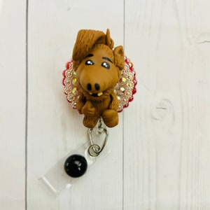Funny 80s tv cat eating alien themed badge reel