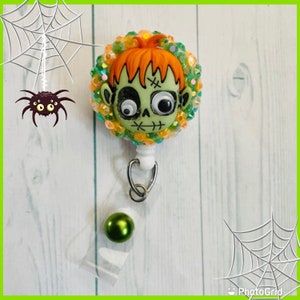 Zombie red headed stepchild badge reel