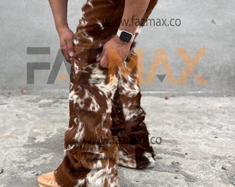 May include: Brown and white patterned pants with a furry texture. The pants have a flared leg design and are made of a soft, animal-like material. The pants are shown in a full-length view.