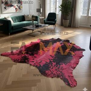 May include: A large, irregularly shaped rug with a pink and black cowhide pattern. The rug is displayed on a wooden floor in a living room setting. The rug's dimensions are not visible in the image.