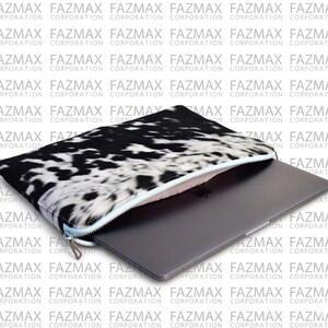 May include: A laptop sleeve with a black and white cowhide pattern and a silver zip. A grey laptop is visible inside the open sleeve. The background has a repeating pattern of the words "FAZMAX CORPORATION".