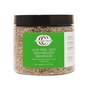 May include: A clear jar with a black lid filled with lime peel zest dehydrated granules. The label states "Lime Peel Zest Dehydrated Granules" and "Net Weight 170 g". The product is made with non-GMO US fruit and is gluten-free.