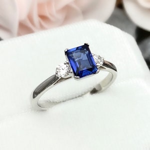 Emerald Cut 1.00Ct Blue Sapphire Three Stone Round Simulated Diamond Sterling Silver Engagement Wedding Ring