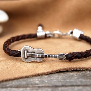 Guitar leather bracelet. For adults and children. Braided by hand, with 1st quality leather. Silver plated guitar. For music lovers.