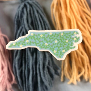 A vinyl sticker in the shape of the state of North Carolina. Great whether you live in NC or you like to visit to vacation on our beaches