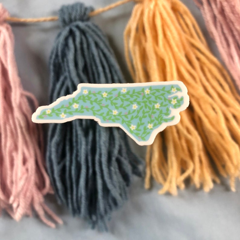 A vinyl sticker in the shape of the state of North Carolina. Great whether you live in NC or you like to visit to vacation on our beaches