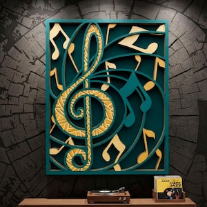 May include: A rectangular wall art piece featuring a large gold treble clef layered over a dark teal background with various gold musical notes. The text DXF, AI, SVG and DIGITAL CUTTING FILE is displayed in yellow on the sides of the image.